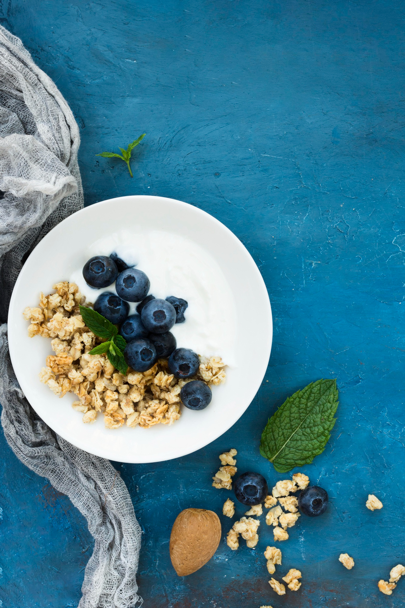 A weekly meal planning notebook surrounded by simple fresh ingredients